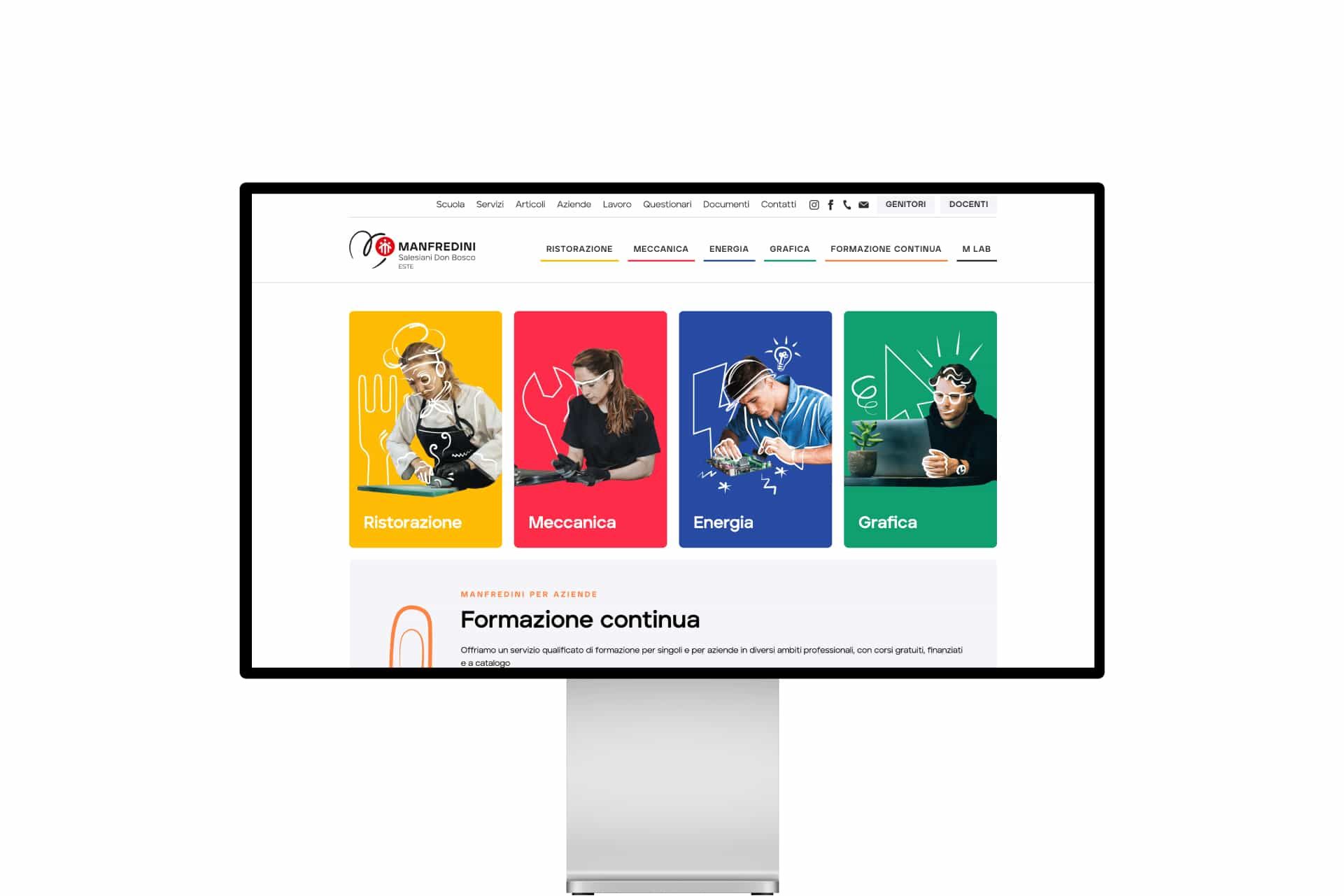 The cfpmanfredini.com website on a monitor, with the Catering, Mechanics, Energy and Graphic design areas