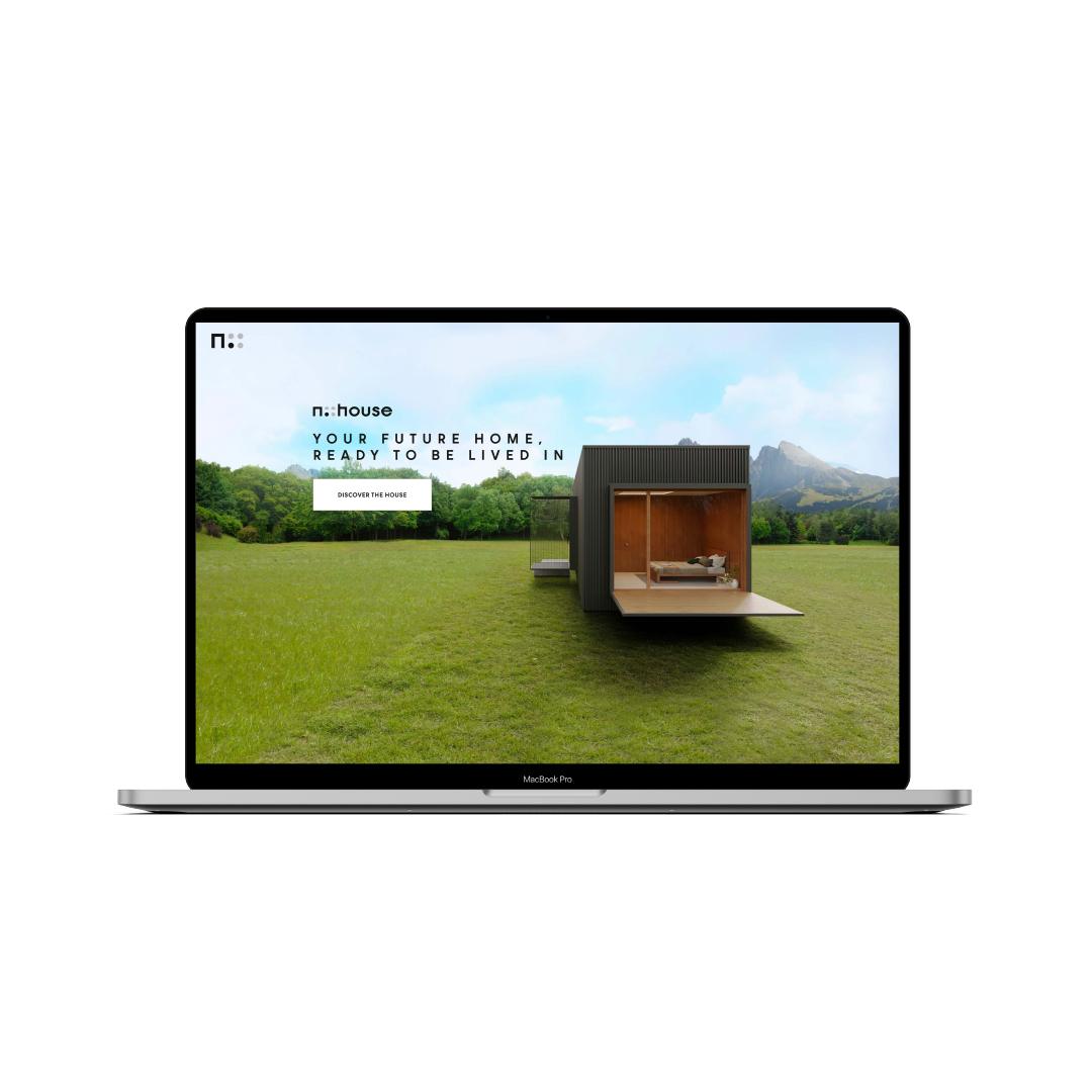The nHouse website on a laptop: the home page with the headline Your future home, ready to be lived in