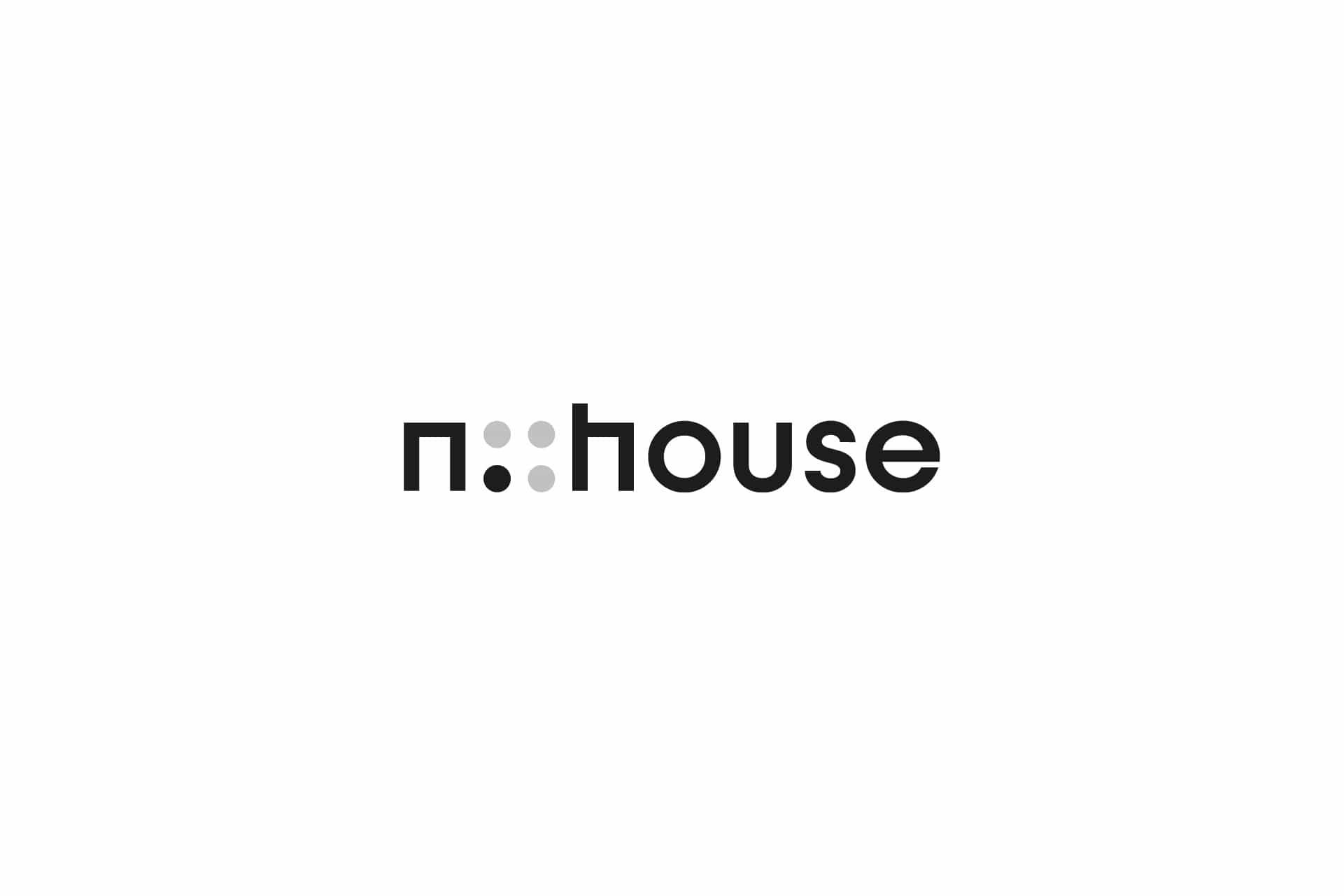 The n::house logo: an n, four dots, two black and two grey, and the word house