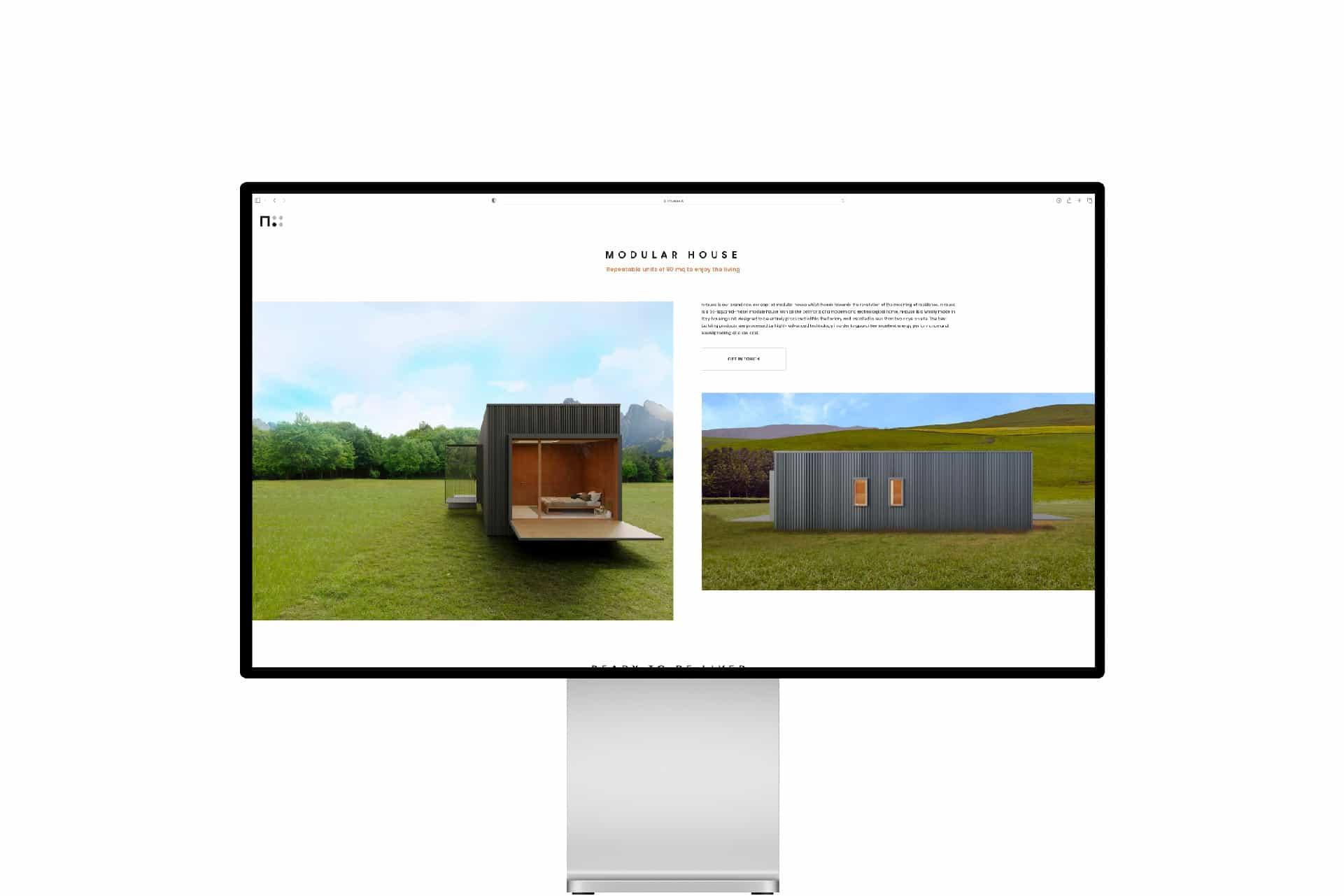 The nHouse website on a monitor, with the Modular house section and two renders of the module