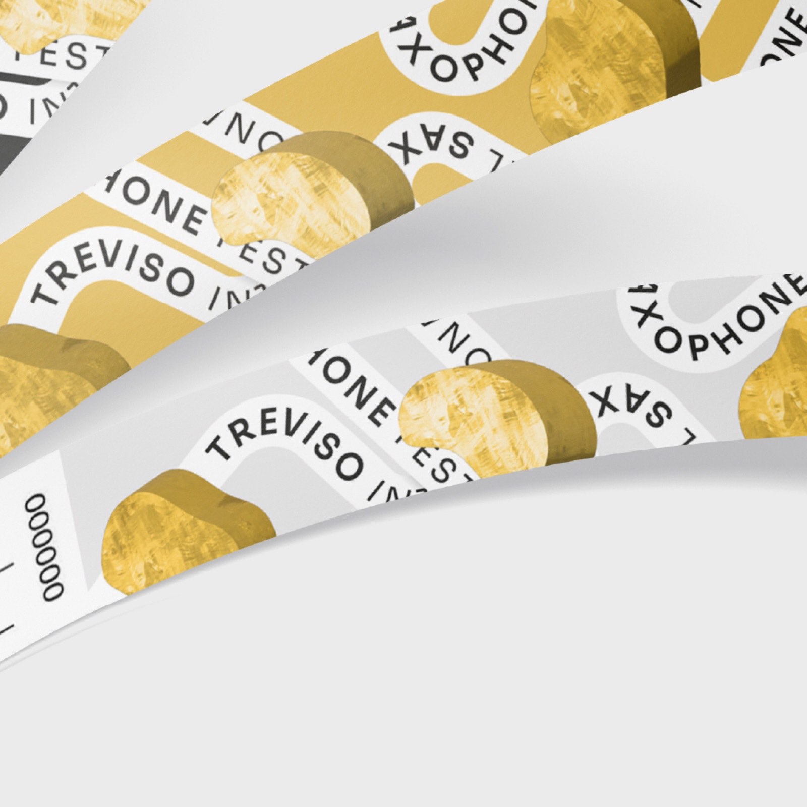 Braccialetti del festival in bianco e oro con il nastro e il nome del festival